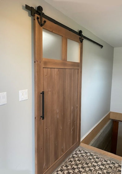 Viba Craftsman barn door with Cottage Life soft close barn door hardware.  Stain is Colonial.