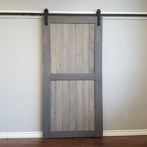 Bent Strap soft close barn door hardware on a Divided barn door, stained for the client in Weathered Grey.