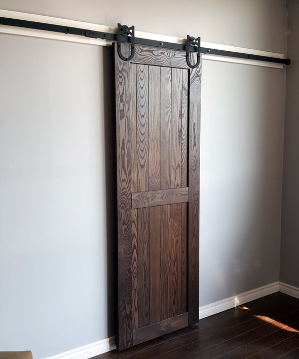 The hardwood farm door is a classic style in beautifully grained ash, shown here in black cherry stain.